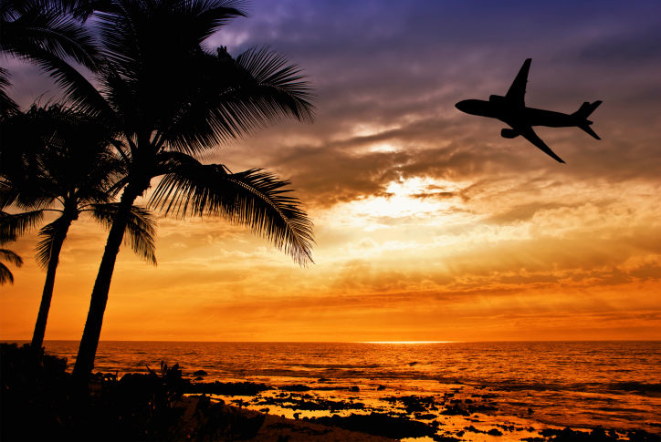 Airplane in Hawaii sunset