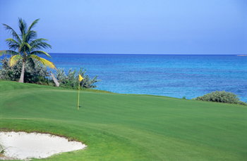 Golf course green next to the ocean