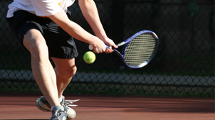 Tennis player hitting a ball